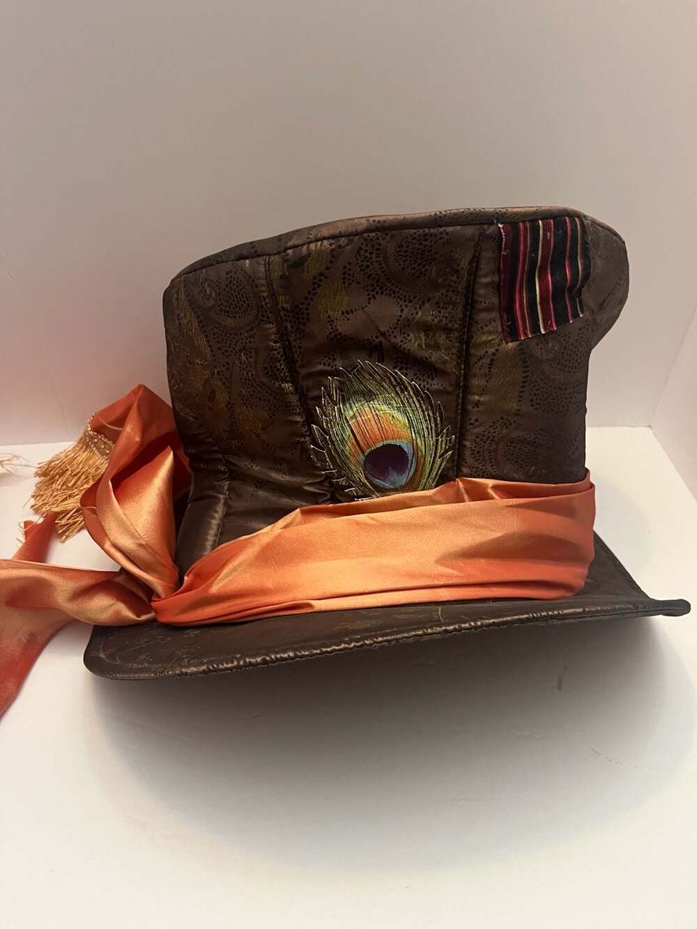 Disney Brown Top Hat with Orange Sash and Peacock Feather Accent